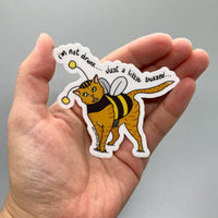 Persnickety Pets: Marmalade buzzed vinyl sticker in palm
